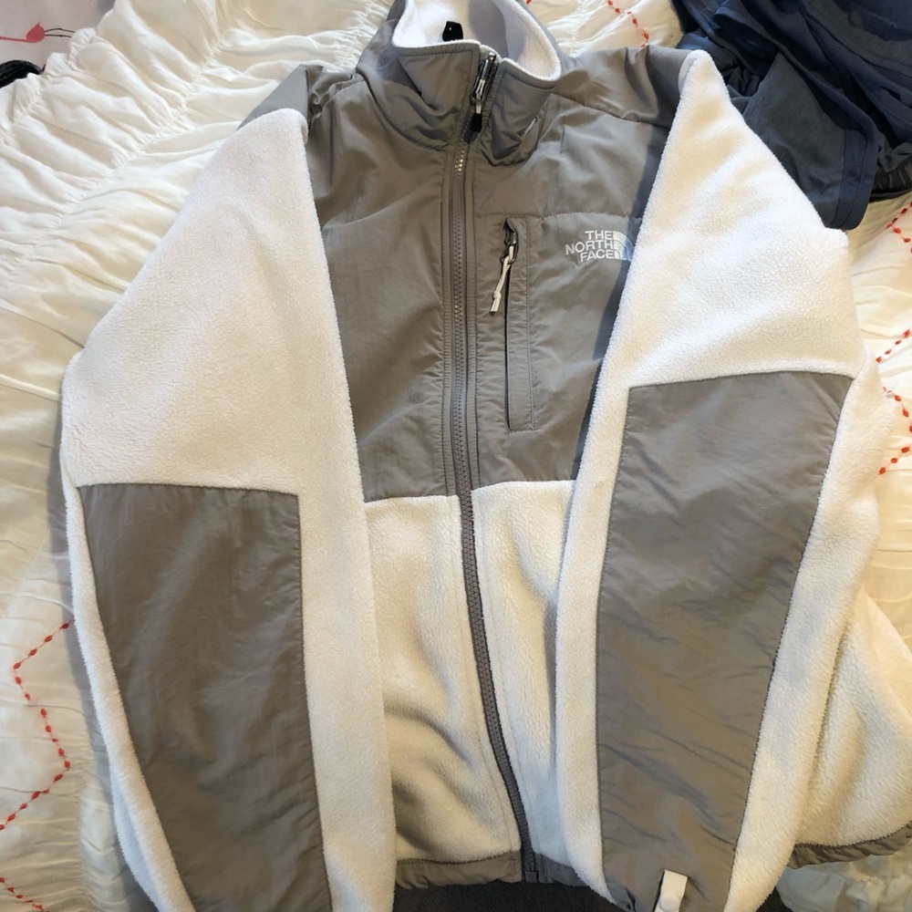 White and grey north face winter jacket